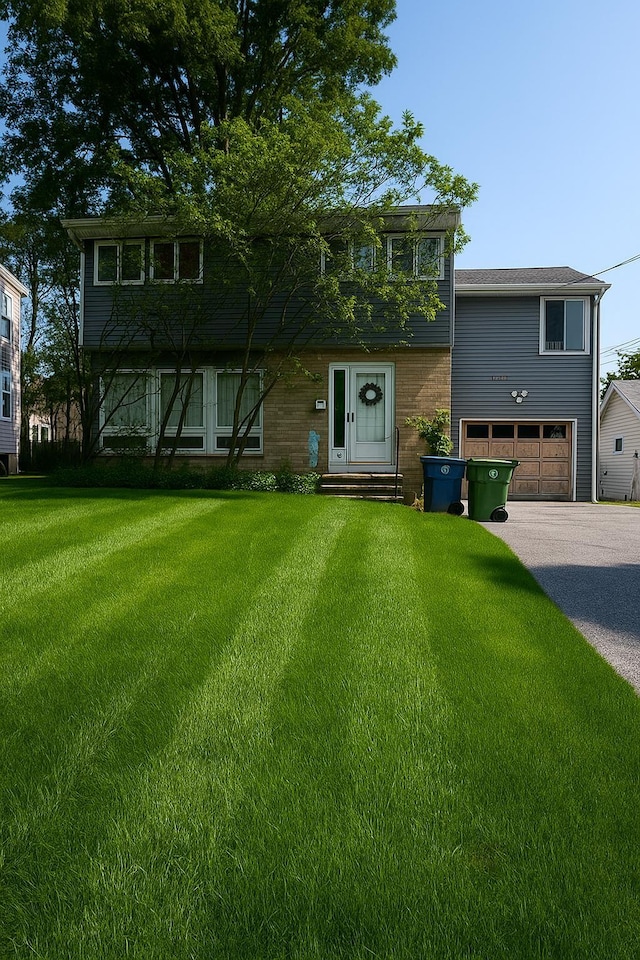 6 Randall Ter, Middletown, NY 10940 - view of front of house with an attached garage, a front lawn, driveway, and entry steps