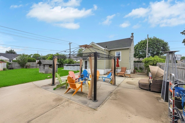331 44th St, Lindenhurst, NY 11757 - fenced backyard featuring a gazebo, a patio area, and an outdoor structure