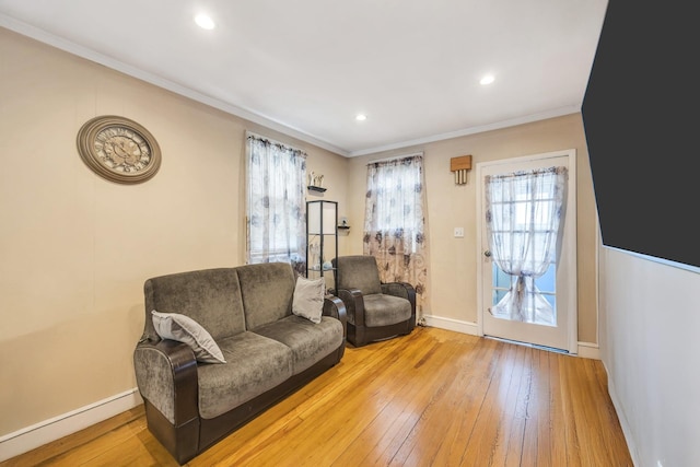 331 44th St, Lindenhurst, NY 11757 - living area featuring crown molding, light wood-style floors, and recessed lighting