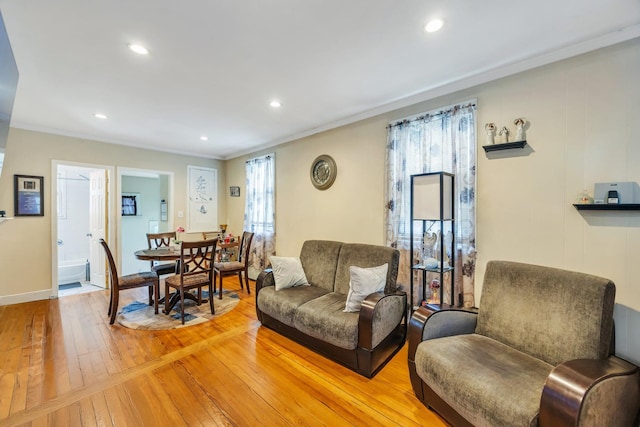 331 44th St, Lindenhurst, NY 11757 - living room featuring crown molding, plenty of natural light, light wood-type flooring, and recessed lighting