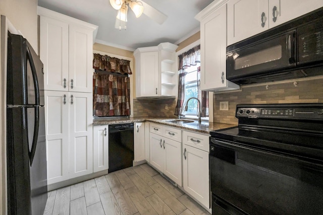 331 44th St, Lindenhurst, NY 11757 - kitchen with black appliances, decorative backsplash, light stone counters, white cabinetry, and open shelves