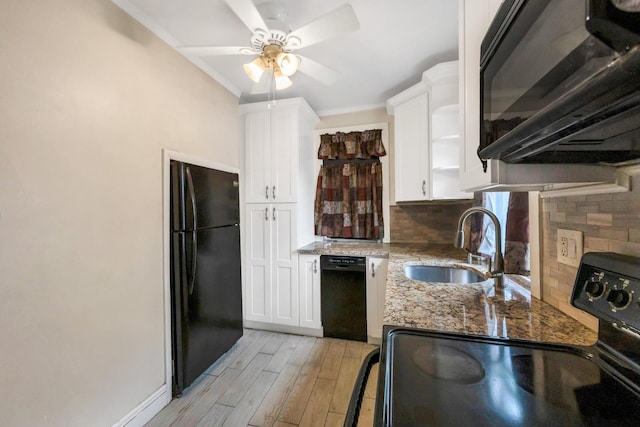 331 44th St, Lindenhurst, NY 11757 - kitchen with black appliances, a ceiling fan, white cabinets, tasteful backsplash, and light stone countertops