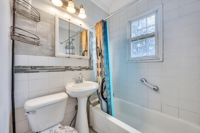 331 44th St, Lindenhurst, NY 11757 - full bathroom with tile walls, shower / bath combo with shower curtain, and decorative backsplash