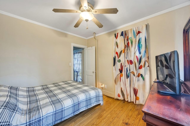 331 44th St, Lindenhurst, NY 11757 - bedroom featuring light wood-type flooring, ornamental molding, and a ceiling fan