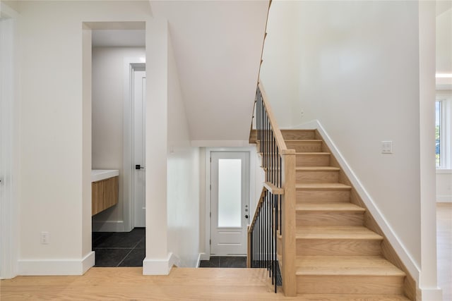 3 Jay St Unit 214, Spring Valley, NY 10977 - staircase with baseboards and tile patterned floors