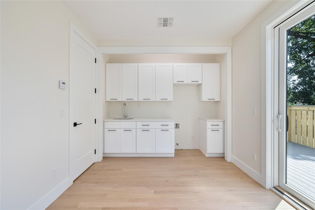 3 Jay St Unit 214, Spring Valley, NY 10977 - washroom featuring light wood finished floors and a sink
