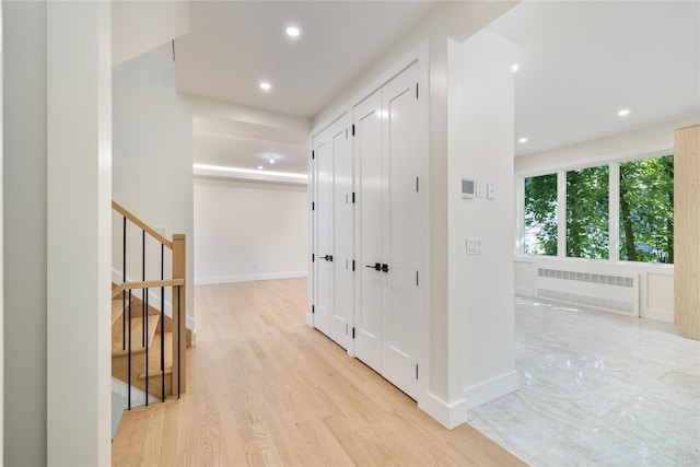3 Jay St Unit 214, Spring Valley, NY 10977 - hallway featuring radiator, light wood finished floors, recessed lighting, and stairs