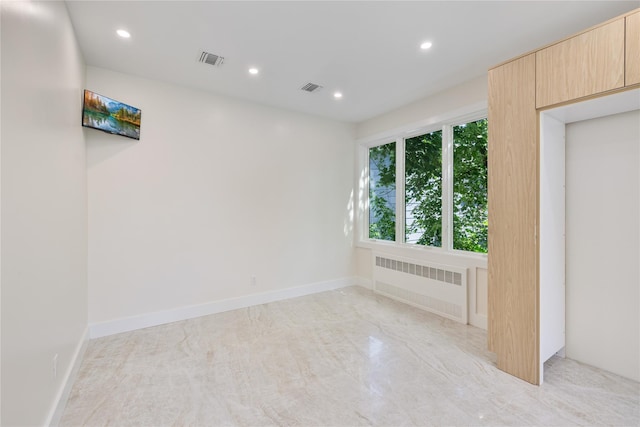 3 Jay St Unit 214, Spring Valley, NY 10977 - spare room with radiator heating unit and recessed lighting