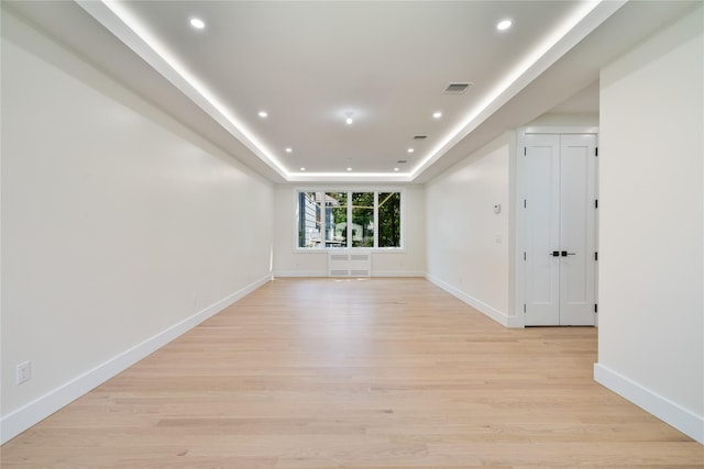 3 Jay St Unit 214, Spring Valley, NY 10977 - unfurnished room featuring light wood-type flooring, a tray ceiling, and recessed lighting