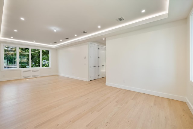 3 Jay St Unit 214, Spring Valley, NY 10977 - spare room featuring a raised ceiling, light wood-style flooring, and recessed lighting