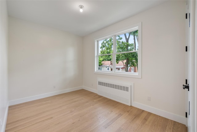 3 Jay St Unit 214, Spring Valley, NY 10977 - empty room with radiator and light wood-style flooring