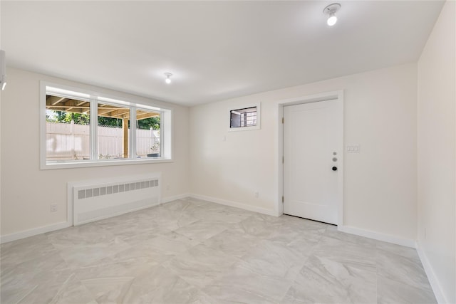 3 Jay St Unit 214, Spring Valley, NY 10977 - spare room featuring radiator and baseboards