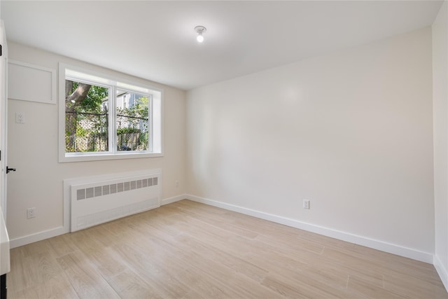 3 Jay St Unit 214, Spring Valley, NY 10977 - spare room with radiator and light wood-style flooring