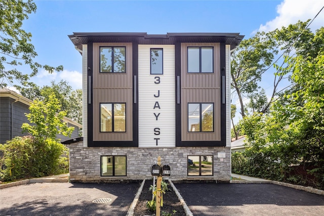 3 Jay St Unit 214, Spring Valley, NY 10977 - view of front of property with stone siding and uncovered parking