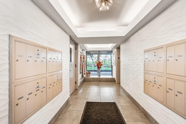 166-41 Powells Cove Blvd Unit 4B, Beechhurst, NY 11357 - hall with mail area, a tray ceiling, and light tile patterned floors