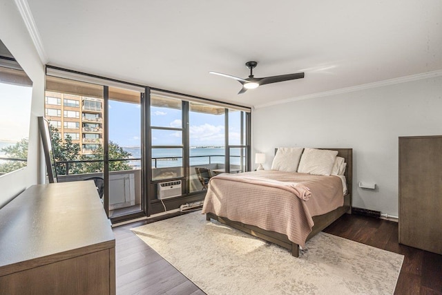 166-41 Powells Cove Blvd Unit 4B, Beechhurst, NY 11357 - bedroom with crown molding, multiple windows, access to exterior, a water view, and wood finished floors