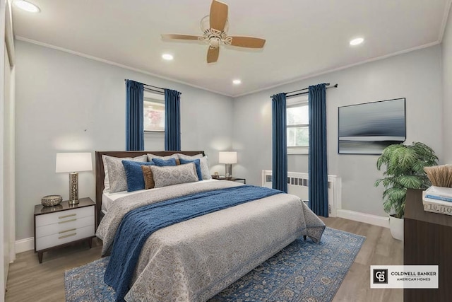 404 Foxdale Ave, Oceanside, NY 11572 - bedroom with wood finished floors, recessed lighting, crown molding, radiator, and ceiling fan