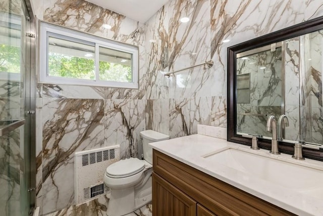 404 Foxdale Ave, Oceanside, NY 11572 - full bath with radiator heating unit, vanity, a marble finish shower, marble tiled floors, and tile walls
