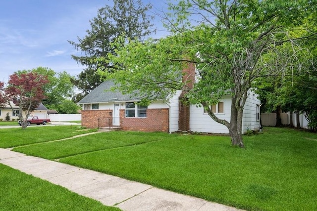 404 Foxdale Ave, Oceanside, NY 11572 - view of front of property with brick siding and a chimney