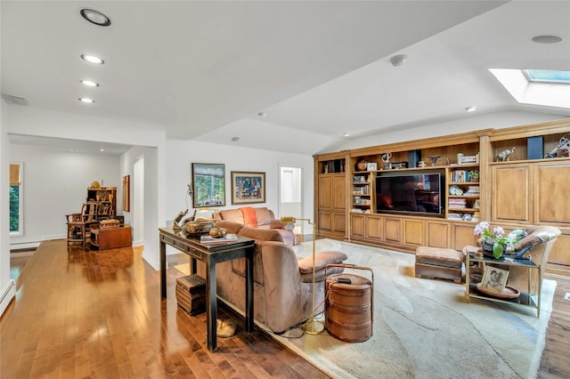 74 Woods Dr, Roslyn, NY 11576 - living area featuring a skylight, lofted ceiling, wood finished floors, recessed lighting, and baseboard heating