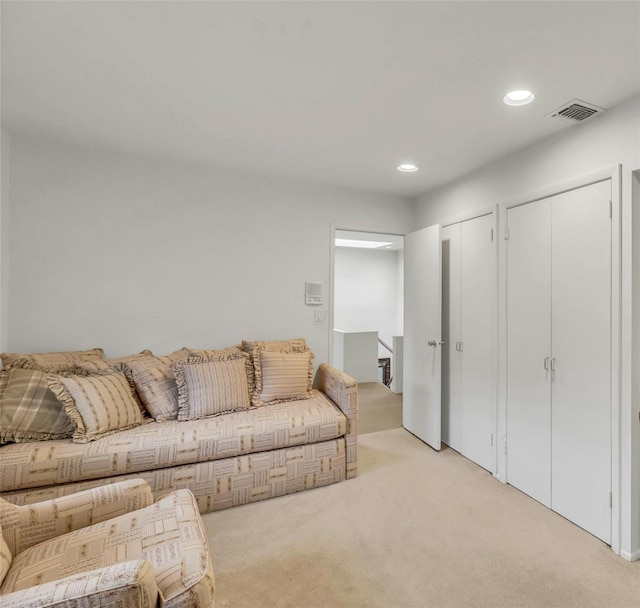 74 Woods Dr, Roslyn, NY 11576 - living area featuring light carpet and recessed lighting