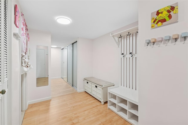 102-30 66th Rd Unit 1G, Forest Hills, NY 11375 - mudroom featuring light wood-style flooring and baseboards