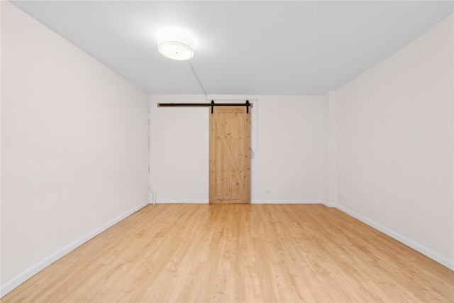 102-30 66th Rd Unit 1G, Forest Hills, NY 11375 - spare room featuring light wood-type flooring and a barn door