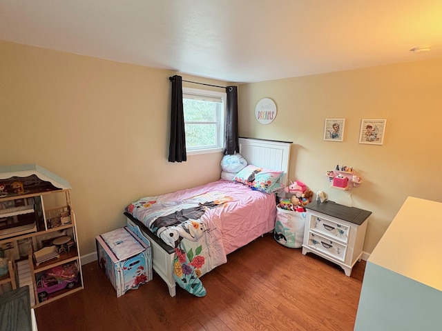 93 Holiday Park Dr, Centereach, NY 11720 - bedroom featuring wood finished floors