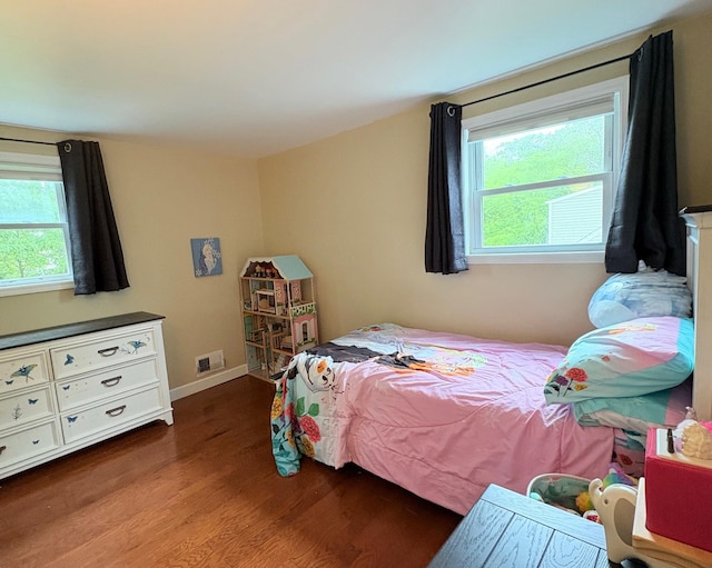 93 Holiday Park Dr, Centereach, NY 11720 - bedroom with wood finished floors and multiple windows