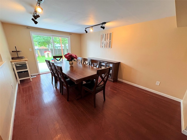 93 Holiday Park Dr, Centereach, NY 11720 - dining space featuring track lighting and dark wood finished floors