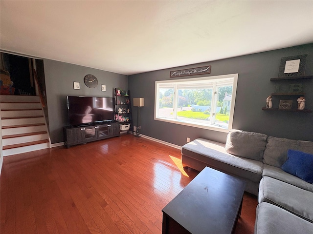 93 Holiday Park Dr, Centereach, NY 11720 - living room featuring stairs and wood finished floors