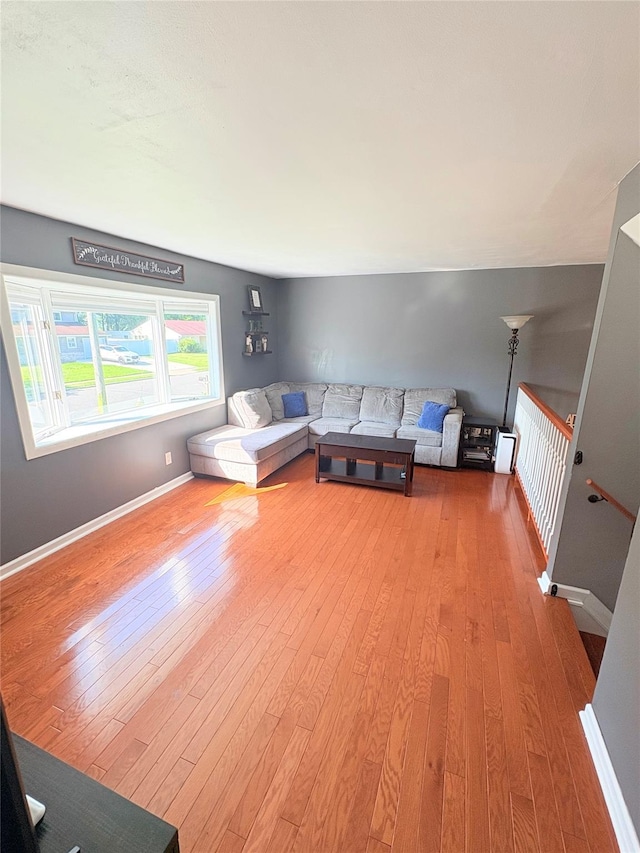 93 Holiday Park Dr, Centereach, NY 11720 - living room featuring wood finished floors