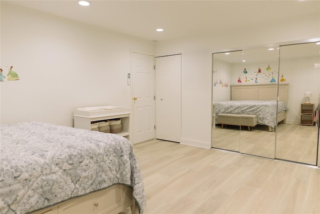 21 Canterbury Rd Unit 3, Great Neck, NY 11021 - bedroom with light wood-style flooring, recessed lighting, and multiple closets