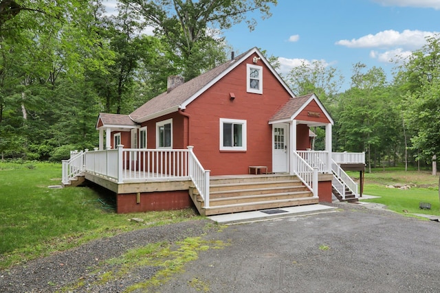 160 S Mountain Rd, New City, NY 10956 - view of front of property with roof with shingles, a front lawn, a chimney, and a deck