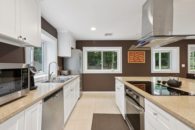 160 S Mountain Rd, New City, NY 10956 - kitchen featuring stainless steel appliances, island exhaust hood, white cabinets, light stone counters, and recessed lighting