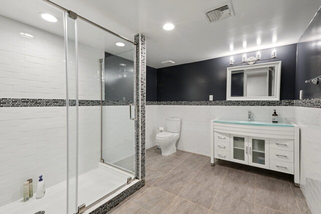 160 S Mountain Rd, New City, NY 10956 - full bathroom with tile walls, a shower stall, vanity, tile patterned flooring, and recessed lighting