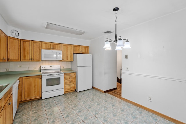 39 Knollwood Ln, Cold Spring, NY 10516 - kitchen with white appliances, tasteful backsplash, a chandelier, decorative light fixtures, and brown cabinets