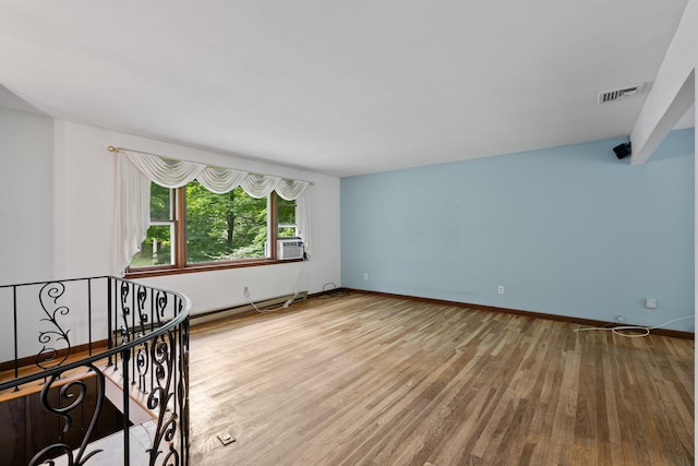 39 Knollwood Ln, Cold Spring, NY 10516 - unfurnished room with a baseboard radiator, wood finished floors, and cooling unit