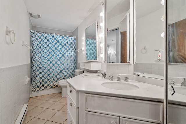 39 Knollwood Ln, Cold Spring, NY 10516 - bathroom featuring tile walls, baseboard heating, double vanity, tile patterned flooring, and curtained shower