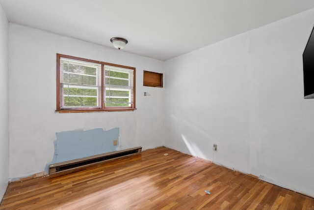 39 Knollwood Ln, Cold Spring, NY 10516 - empty room with baseboard heating and wood finished floors