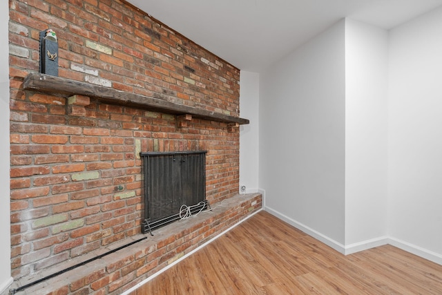 39 Knollwood Ln, Cold Spring, NY 10516 - unfurnished living room featuring wood finished floors and a brick fireplace