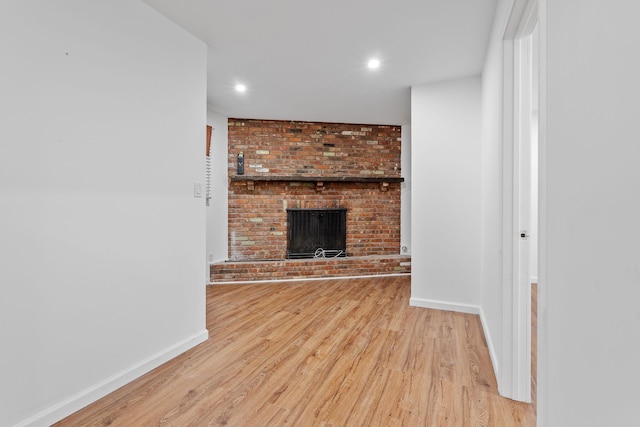 39 Knollwood Ln, Cold Spring, NY 10516 - unfurnished living room with wood finished floors, recessed lighting, and a brick fireplace