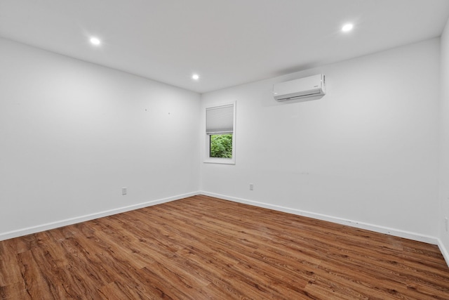 39 Knollwood Ln, Cold Spring, NY 10516 - empty room with a wall mounted air conditioner, wood finished floors, and recessed lighting