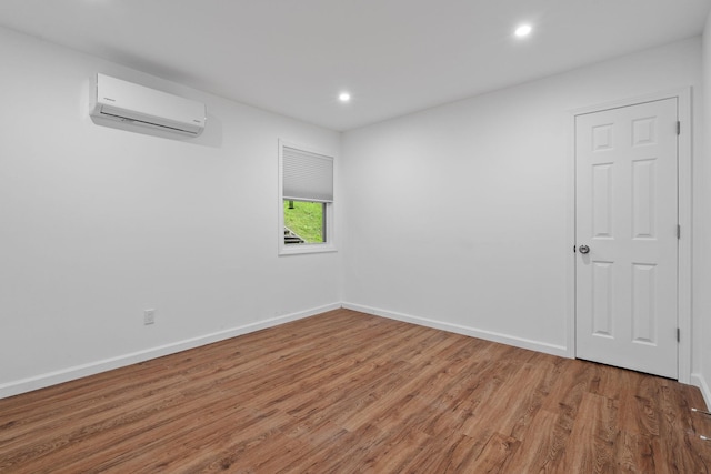 39 Knollwood Ln, Cold Spring, NY 10516 - spare room featuring a wall unit AC, wood finished floors, and recessed lighting
