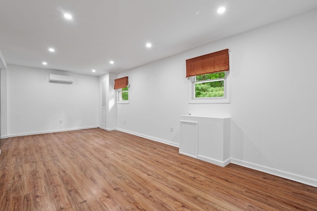 39 Knollwood Ln, Cold Spring, NY 10516 - unfurnished room featuring an AC wall unit, recessed lighting, and light wood-type flooring