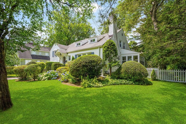 44 Kingsbury Rd, New Rochelle, NY 10804 - view of front of property featuring a chimney and a sunroom