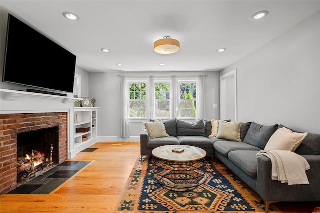 44 Kingsbury Rd, New Rochelle, NY 10804 - living area with light wood finished floors, recessed lighting, and a fireplace