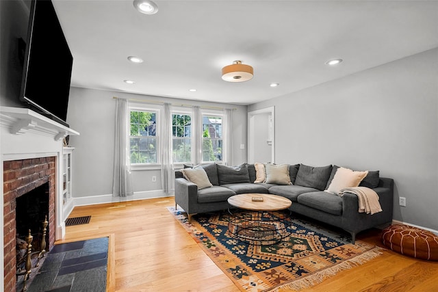 44 Kingsbury Rd, New Rochelle, NY 10804 - living room with light wood-type flooring, recessed lighting, and a fireplace