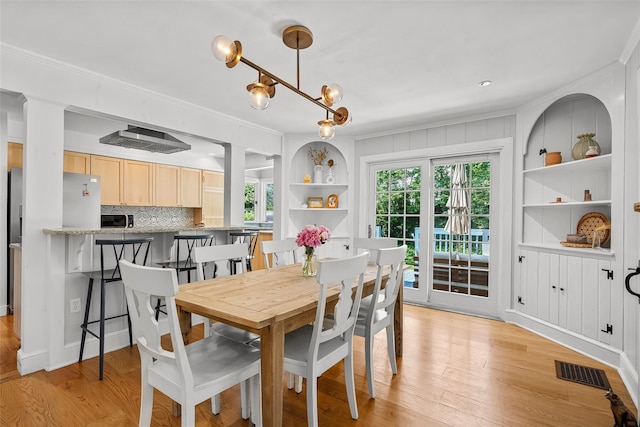 44 Kingsbury Rd, New Rochelle, NY 10804 - dining room with plenty of natural light, light wood-type flooring, and ornamental molding