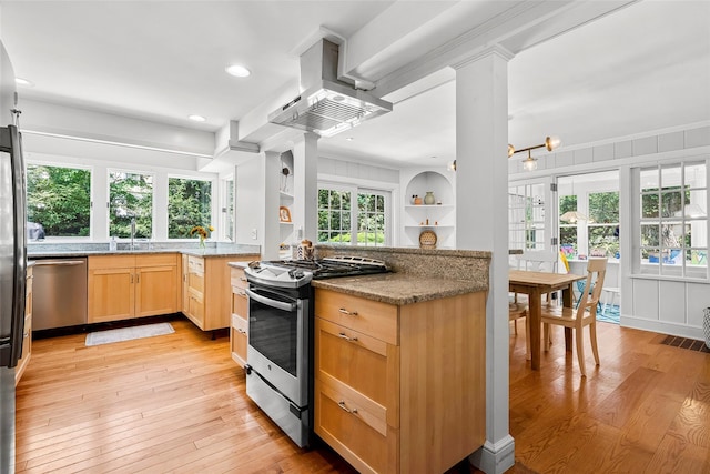 44 Kingsbury Rd, New Rochelle, NY 10804 - kitchen with stainless steel appliances, island range hood, light brown cabinetry, light wood finished floors, and recessed lighting